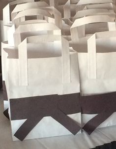 several bags are stacked on top of each other in the shape of an abstract pattern