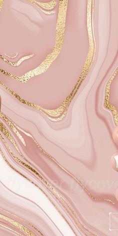 a pink and gold marble background with white dots