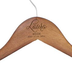 a personalized wooden hanger for a bride