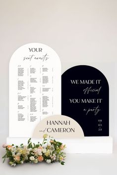 the wedding seating chart and flowers are on display