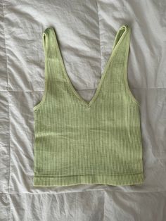 these tanks are made with super-elastic materials for maximum comfort & durability! they are one size fits most <3 they can be worn with the v neck in the front or the back depending on the look you’re going for! worn with the “do it” zip up! Seamless Green Tank Top For Spring, Green Vest Tops For Vacation, Trendy Cotton V-neck Top For Summer, Trendy V-neck Vest For Summer, Seamless V-neck Crop Top For Vacation, Basic Green Tank Top For Summer, Basic Green Tank Top For Spring, Trendy Green Crop Top For Everyday, Casual Seamless Summer Vest