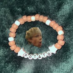 This product is a sturdy friendship bracelet made from pony beads. It would make a great gift for fans of Niall Horan or One Direction! One Direction Gift Ideas, Niall Horan Nails Ideas, Nails Inspired By Niall Horan, The Show Nails Niall Horan, Niall Horan Friendship Bracelet, 1d Merch, Niall Horan Beaded Bracelet