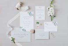 the wedding stationery is laid out and ready to be put into the bride's bouquet