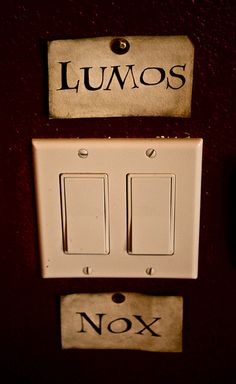 two light switch plates with the words lumos and nox on them