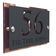 a metal sign with the number fifty six on it