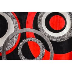 an abstract painting with black, red and white circles on it's surface is featured in this image