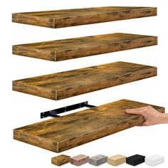 three wooden shelves are shown with different colors and sizes on each shelf, one has a hand reaching for the top