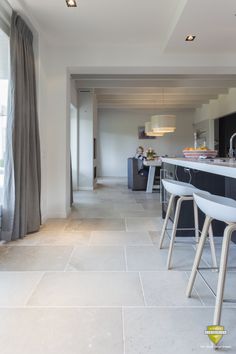 the kitchen is clean and ready to be used as a dining room or living room