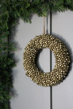 a wreath hanging on the side of a door