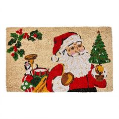 a door mat with santa claus holding a christmas tree and other holiday decorations on it