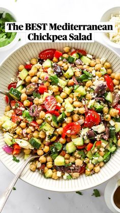 a salad with chickpeas, cucumbers, tomatoes and feta cheese