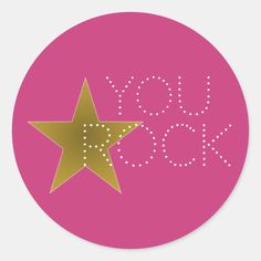 a pink and gold star sticker with the word xox on it