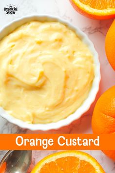 an orange custard in a bowl next to sliced oranges