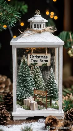 a christmas tree farm is displayed in a lantern