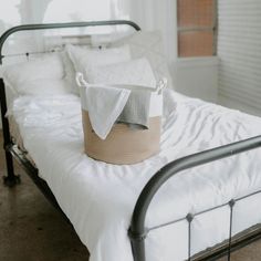 a bed with a basket on top of it