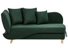 a green couch with four pillows on the back and one arm folded up to show it's curved shape