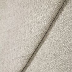 a close up view of a fabric with a needle in the center and an unzipped end