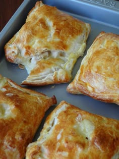 four chicken and leek parcels in a baking pan