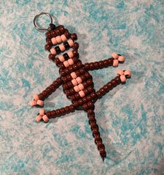 a beaded keychain shaped like a person