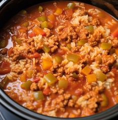 a crock pot filled with ground beef and rice