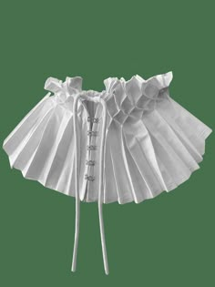 a white corset with ruffles on it