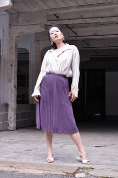 "Vintage high waist pleated skirt in a beautiful shade of lilac. It falls around the knees and has a zipper and snap button fastening. The model is 5'7 and size 8 (UK). MEASUREMENTS Waist: 61 cm / 24\" Hips: 91.5 cm / 36\" Length: 70 cm / 27.5\" In excellent condition. FREE UK SHIPPING on orders over £100 - use the code LUCKYUK at checkout." Chic Pleated Purple Bottoms, Chic Purple Pleated Bottoms, Elegant Purple Pleated Skirt, Purple Pleated Bottoms For Spring, Chic Purple Pleated Skirt For Spring, Spring Purple Pleated Maxi Skirt, Purple Flowy Pleated Skirt For Spring, Purple Pleated Flared Skirt, Spring Purple Pleated Skirt