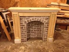 an old brick fireplace is being worked on