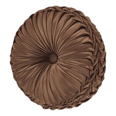 a round pillow with pleated fabric on the top and bottom, in chocolate brown