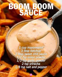 a spoon full of dipping sauce on top of sweet potato fries