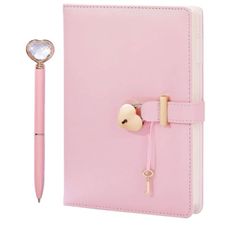 a pink notebook with a pen attached to it