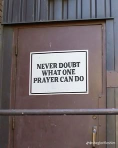 a door with a sign on it that says never doubt what one prayer can do