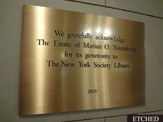 a plaque on the side of a building that reads, we gratefully acknowise the estate of martin o'numing for its generous to the new york society library