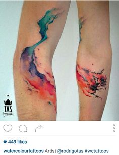 two people with tattoos on their legs and one has a watercolor design on it