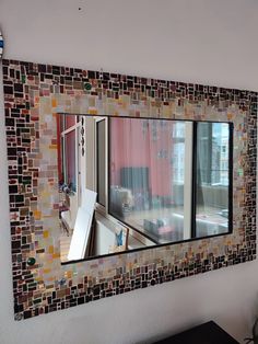 a mirror that is on the side of a wall