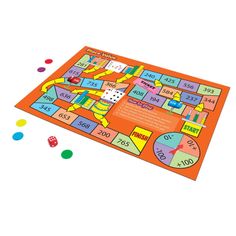 an orange board game with dices and numbers on the floor, including two pieces of paper