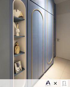 the interior of a bathroom with blue walls and shelves