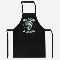 a black apron with the words big daddy is cooking on it and a skull wearing a chef's hat