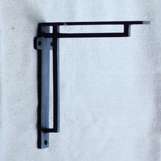 a close up of a metal hook on a wall