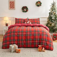 a red plaid comforter set with christmas decorations