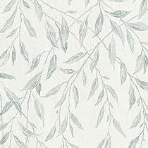 a white wallpaper with green leaves on it