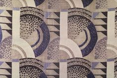 a close up view of an abstract design with blue and white colors on the fabric