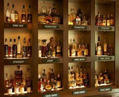 shelves filled with different types of liquor bottles