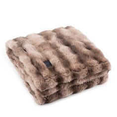 a brown and white fur blanket on a white background