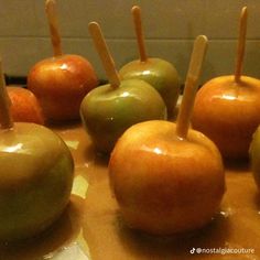 several apples with toothpicks sticking out of them