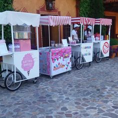 a row of ice cream carts sitting next to each other