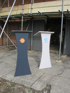 two podiums sitting in front of a building under construction