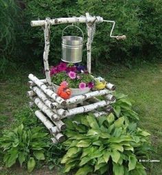 a garden made out of logs and flowers