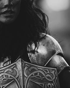 black and white photograph of a woman with tattoos on her back