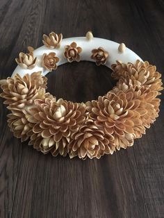 a wreath made out of fake flowers on a table