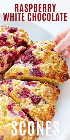 raspberry white chocolate scones on a plate with text overlay that reads, raspberry white chocolate scones